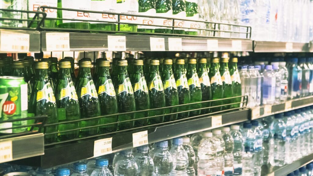 Bottles arranged on a store shelf, a general beverage-shopping illustration