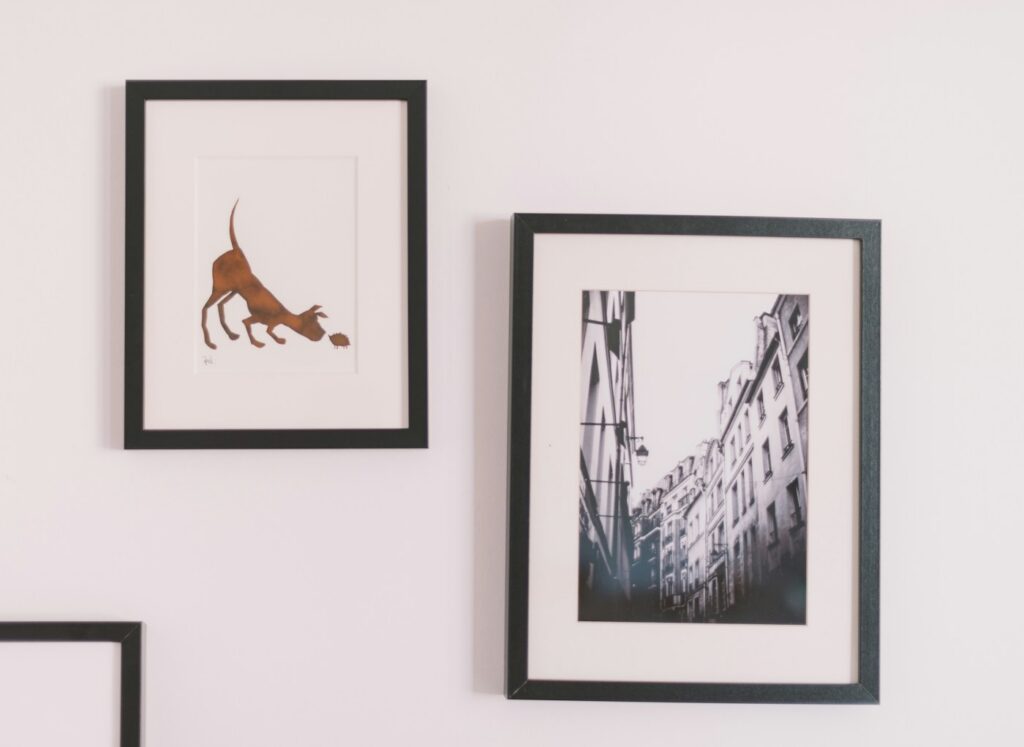 Framed artwork displayed on a wall, illustrating frame size and layout choices