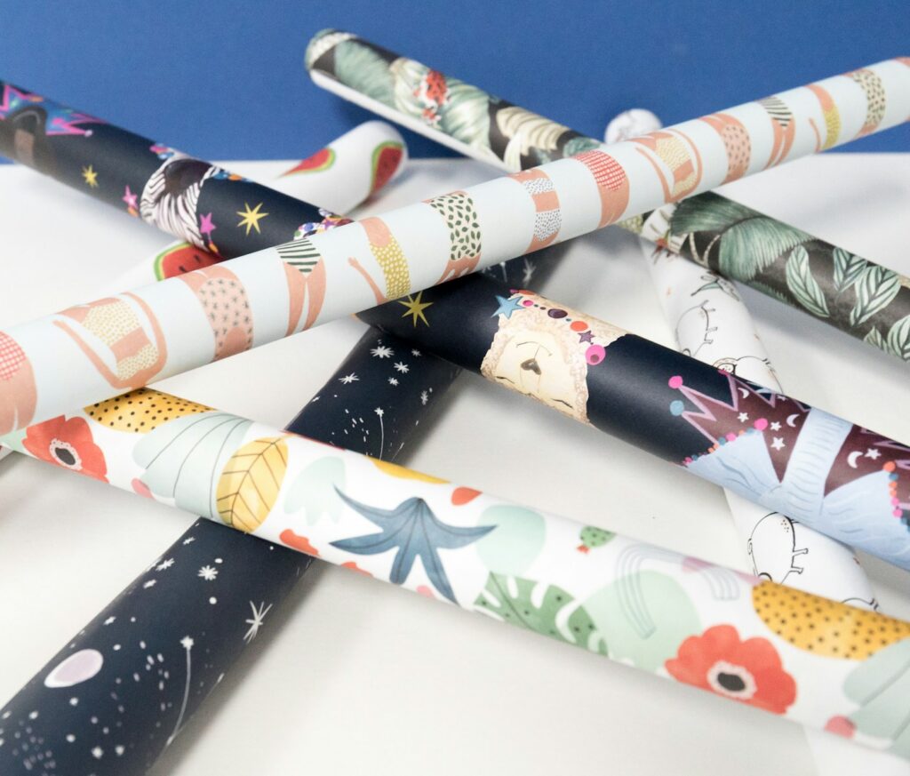 Illustrative patterned gift-wrap rolls, not the Hallmark examples