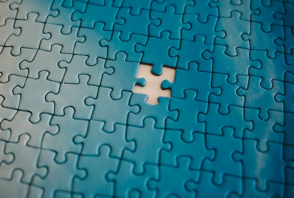 Close view of jigsaw puzzle pieces, illustrative puzzle photograph