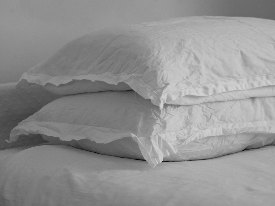 Pillow resting on a bed, used as an illustrative bedding photograph
