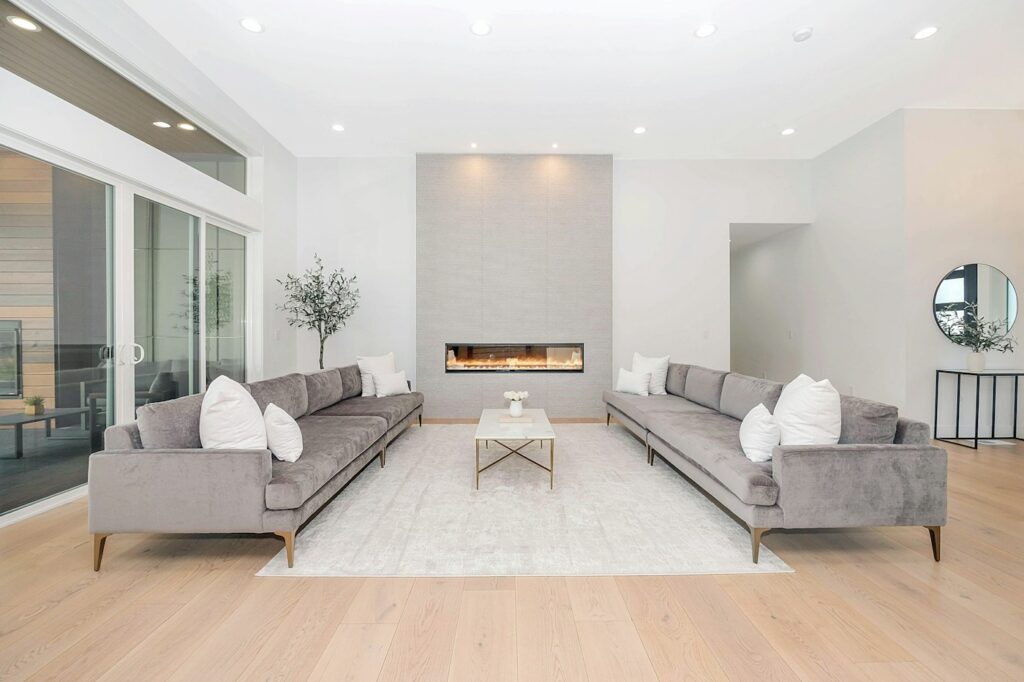 A living room seating area arranged around a rug