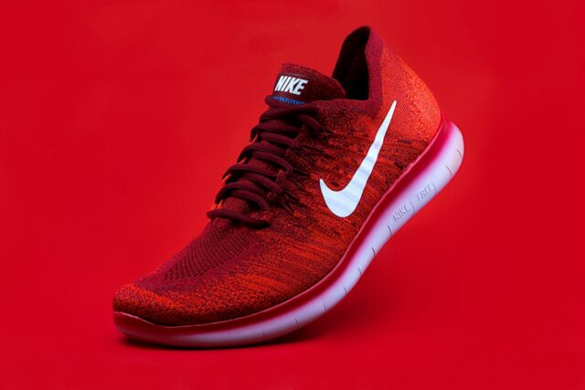 Red Nike sneaker; illustrative image, not a confirmed $9.XX offer