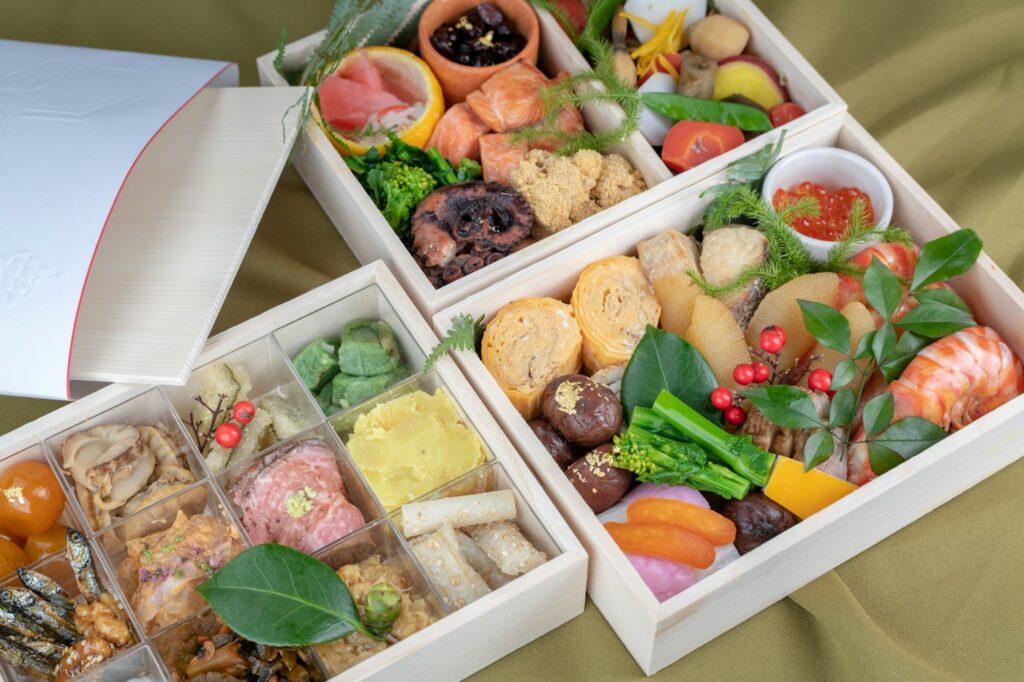 Boxes holding fruit and chocolate snacks