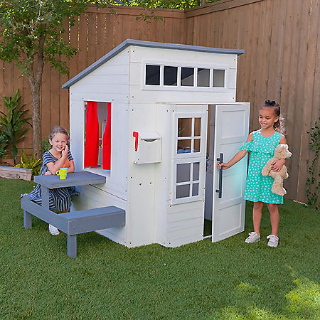 KidKraft Modern Outdoor Wooden Playhouse with Picnic Table, Mailbox and Outdoor Grill, White On Sale At Sam’s Club