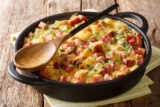 Tasty hot homemade strata with ham, onions, cheese and eggs Recipe